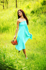 Wall Mural - Woman walking on grass field