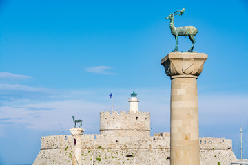 Poster - Agios Nikolaos Fortress (Fort of Saint Nicholas) and deer, a symbol of the Rhodes town, Rhodes island, Greece 