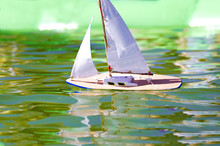 Traditional Small Wooden Sailing Boat In The Pond Of Park