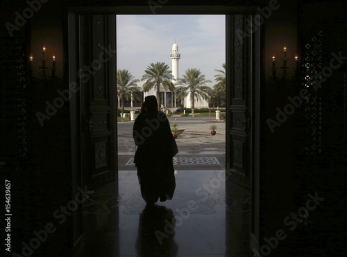 A Man Walks Through The Front Door Of The Safriya Palce