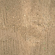 seamless texture of brown fluffy fresh plowed land.