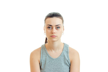 Wall Mural - serious portrait of a young girl with the collected hair that looks straight into the camera