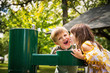 © RooM The Agency - Two children drinking from a water fountain