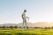 © Jacob Lund - Male golfer standing on golf course
