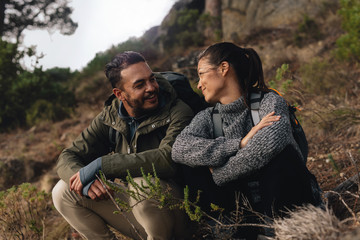 Wall Mural - Young couple taking a break on a hike