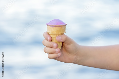 Young Child Hand Holding A Half Eaten Purple Ice Cream Cone Stock Photo Adobe Stock