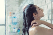 © torwaiphoto - Asian women bathing and she was bathing and washing hair.she is happy