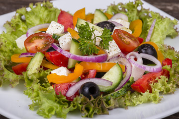 Fresh vegetable greek salad on the table