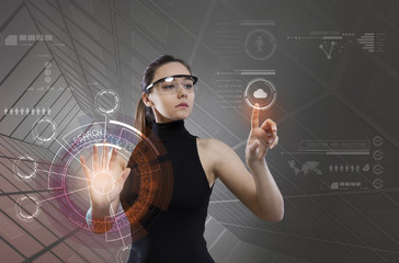 Wall Mural - Woman touching the virtual future interface