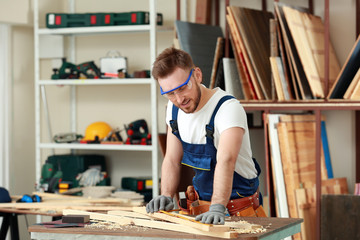 Poster - Handsome young carpenter in workshop