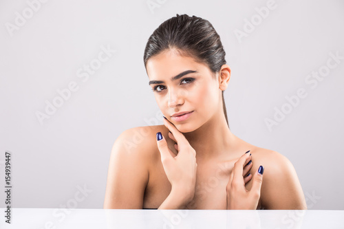 Beautiful Face Of A Young Woman With Clean Fresh Skin Isolated On Beautiful Face Of A Young Woman With Clean Fresh Skin Isolated On Gray Background Close