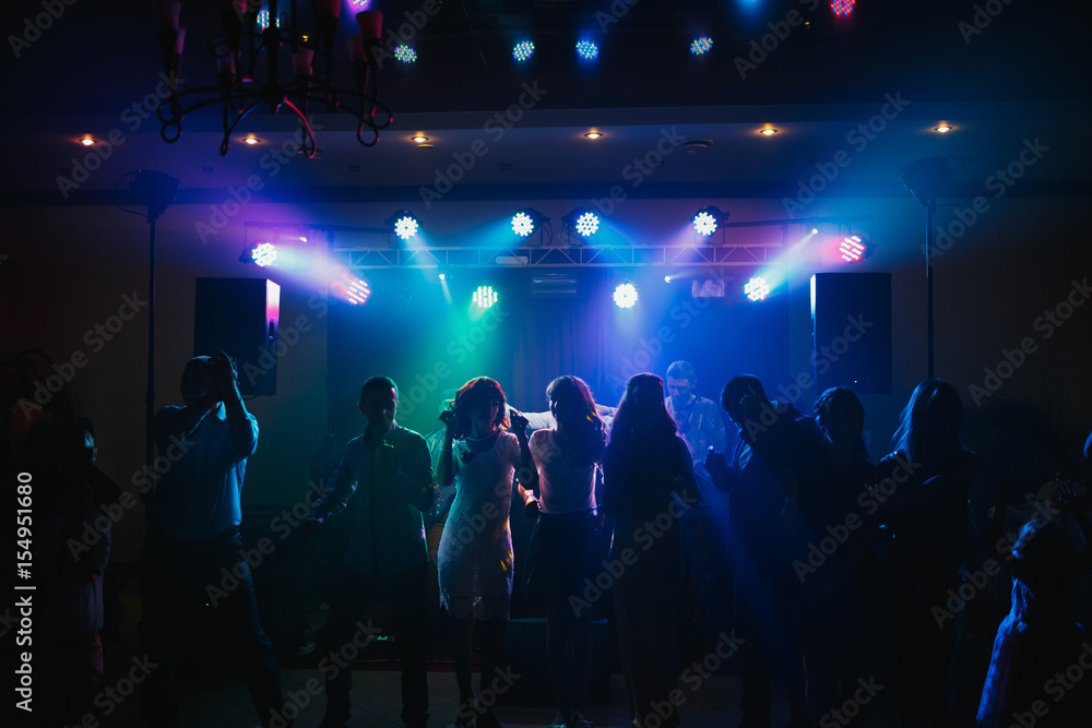 The guests dancing on the dancefloor - obrazy, fototapety, plakaty 