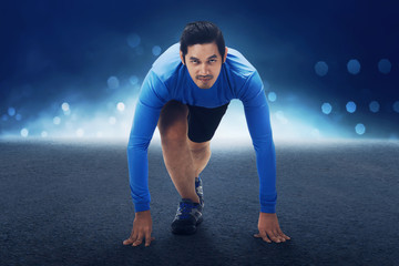 Poster - Runner asian man with hands on starting line ready to sprint