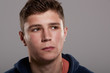 © Monkey Business - Teenage boy looking away, head and shoulders portrait