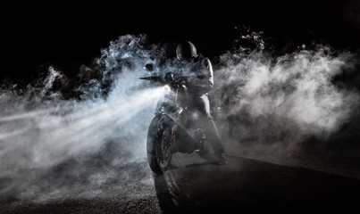 High power motorcycle chopper at night.