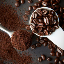 Scoop Of Roasted Coffee Beans, And A Spoon Of Ground Coffee