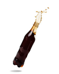 Wall Mural - Soft drinks splash out of bottle on white background.