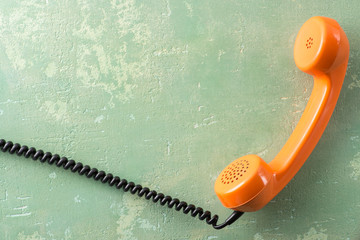 Wall Mural - Vintage handset on a green background