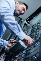 Nice bearded man concentrating on his work