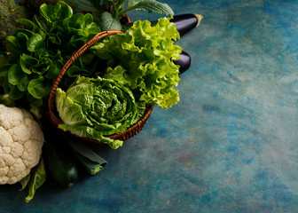 Wall Mural - Fresh green lettuce, cabbage and vegetables in a basket