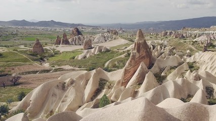 Wall Mural - Amazing view of Turkish fortress Uchisar in the Cappadocia, Turkey. Cappadocia with its valley, ravine, hills, located between the volcanic mountains in Goreme National Park.