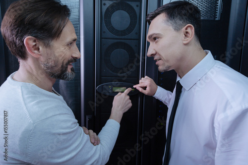 Fotografie, Obraz Handsome nice men pointing at the button