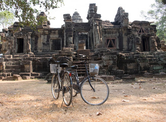 Two bikes on the background of the ruins at Angor Wat