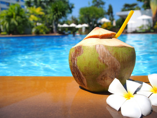 Wall Mural - Fresh coconut and plumeria flower at pool.