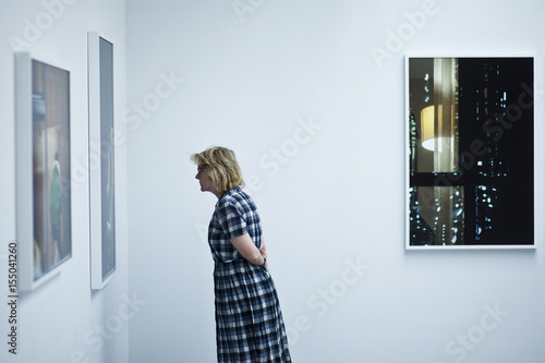 A Woman Attends Arne Svenson Photo Exhibition At Julie Saul -