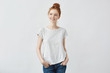 © Cookie Studio - Young beautiful redhead girl smiling.  Copy space.