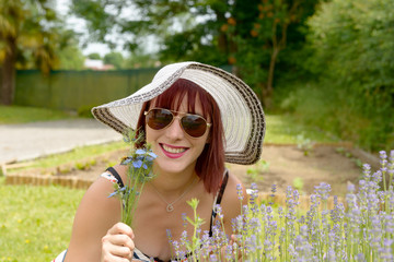 Wall Mural - Portrait of a beautiful girl with summer hat