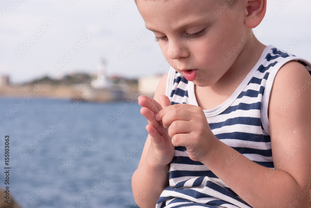Kid Getting Splinter Attentive little boy gets a splinter from his finger Stock Photo ...