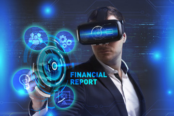 Business, Technology, Internet and network concept. Young businessman working in virtual reality glasses sees the inscription: Financial report