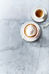 Wall Mural - Cup of Cappuccino and a Cup of Espresso on marble background