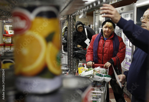 Maria Bonifacio Waits In Line At The Food Bank For New York City