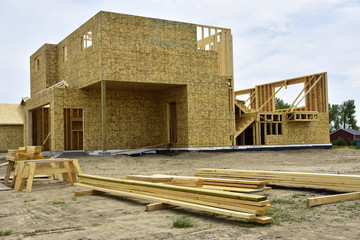 Wall Mural - Wood frame homes under construction.