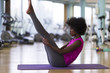 © .shock - african american woman exercise yoga in gym