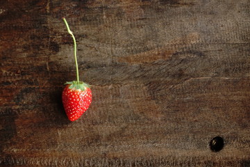 Fresh strawberry on wooden background. 