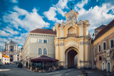 Fototapeta Nowy Jork - Basilian Gates to the Church oh Holy Trinity and Church of St. Teresa on background. Vilnius, Lithuania.