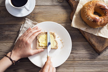Woman Hand Spreading Butter On Sliced Bread