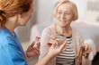 © zinkevych - Kind trained nurse serving a glass of water
