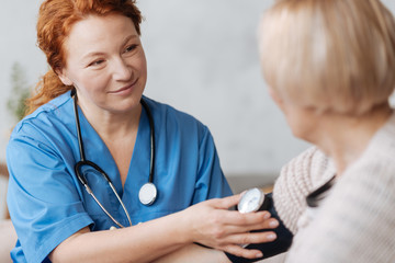 Wall Mural - Mindful excellent private doctor consulting her patient