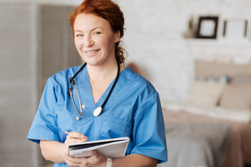 Wall Mural - Cheerful excellent doctor holding consultation at home