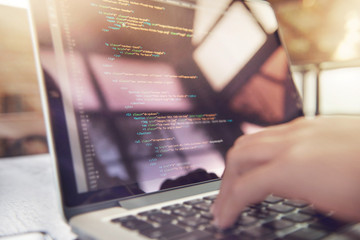 Wall Mural - closeup coding on screen, woman hands coding html and programming on screen laptop, development web,