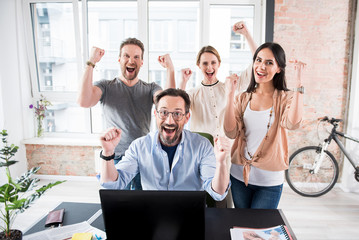 Wall Mural - Hilarious laughing workers in office