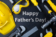 Father's day concept - child tools on black background