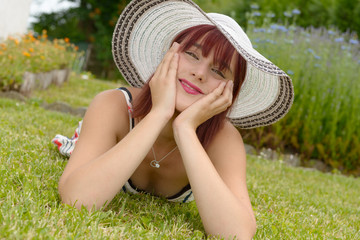 Wall Mural - Portrait of a beautiful girl with summer hat