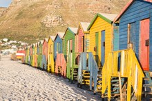 Multi Colored Beach Huts On Sand