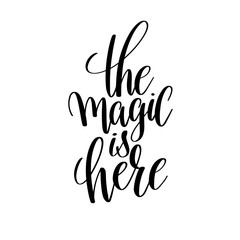 the magic is here black and white hand lettering inscription