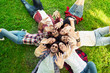© Tijana - Group of young people laying on the grass in circle, happy, smiling